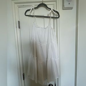 White boutique flowy dress. Ties on shoulders